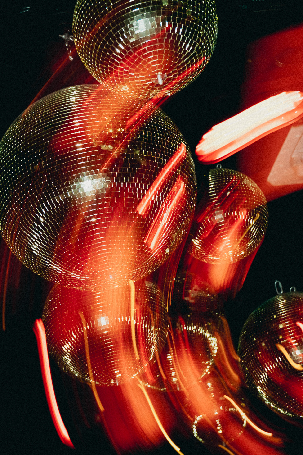 Motion blur across the disco balls.